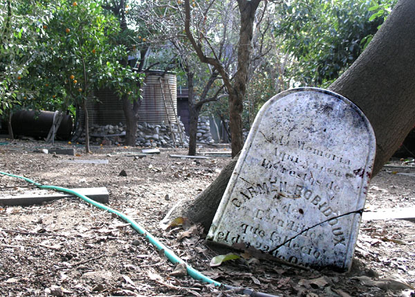 Rubel Castle's graveyard. The grave stone of Carmen Robidoux. Call the Glendora Historical Society. (626) 963-0419